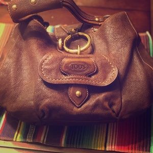 TOD'S brown leather hobo bag w/gold hardware.
